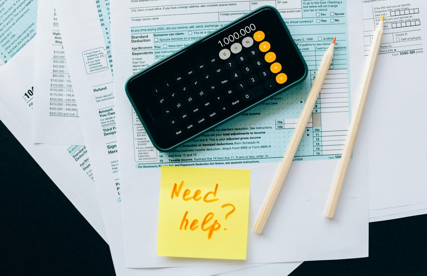 Business professional working on accounting paperwork in the UAE