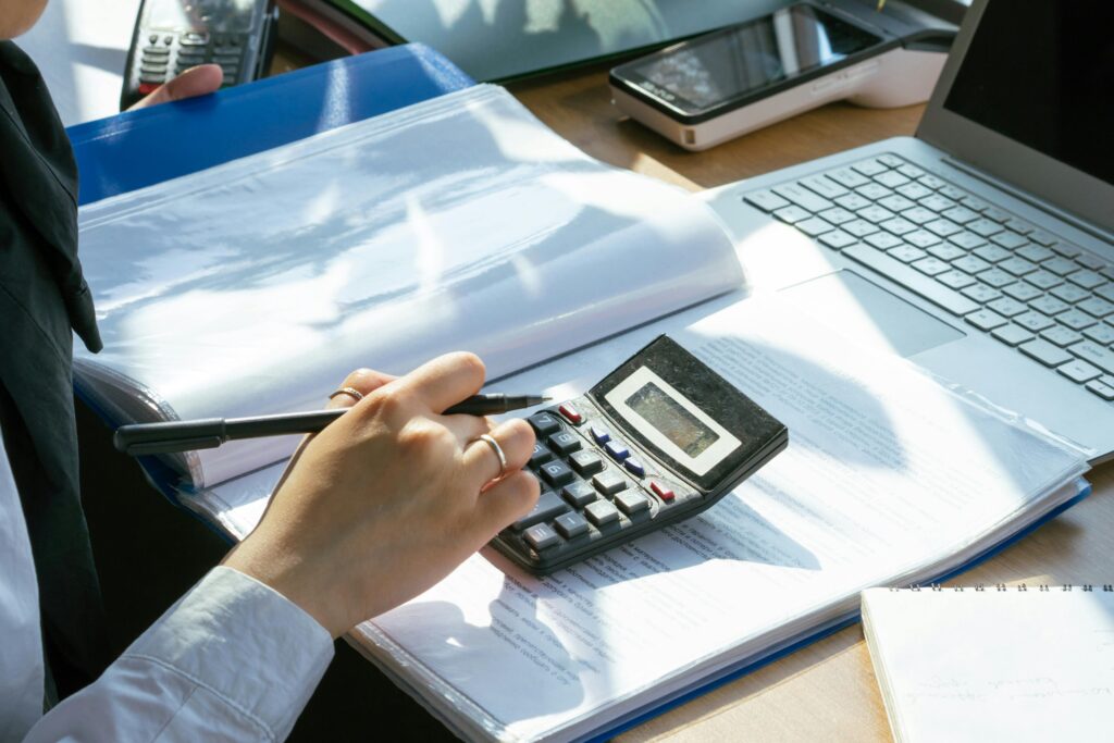Professional accountant discussing financial statements with a business client in Dubai